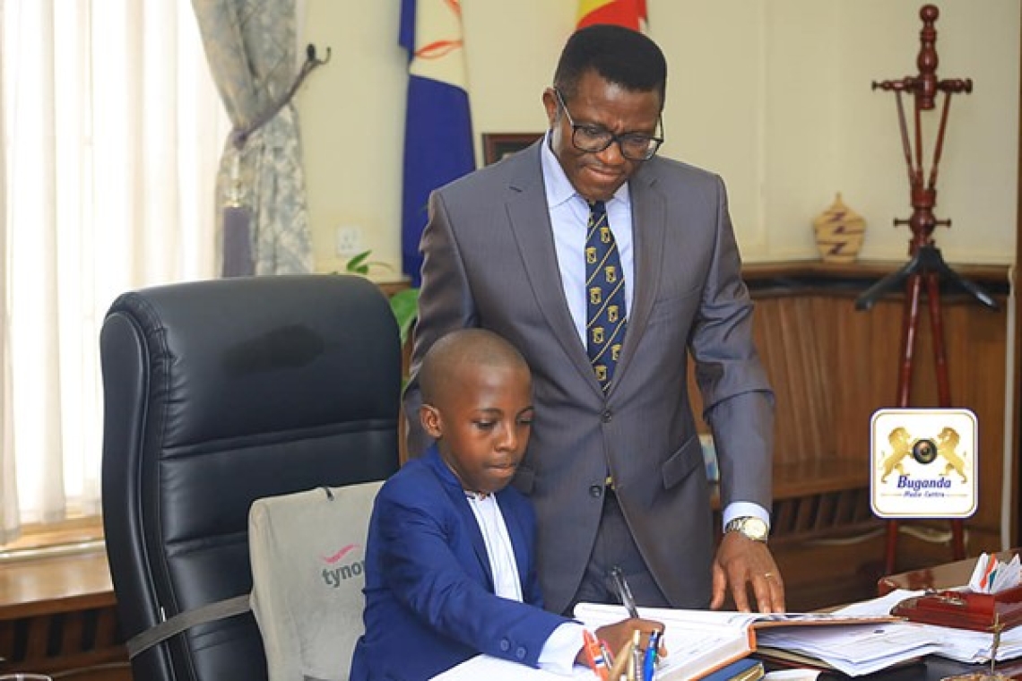 Katikkiro meets a young coffee farmer from Kakiri's Nampunge Area